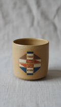 Minimalist ceramic mug with line art